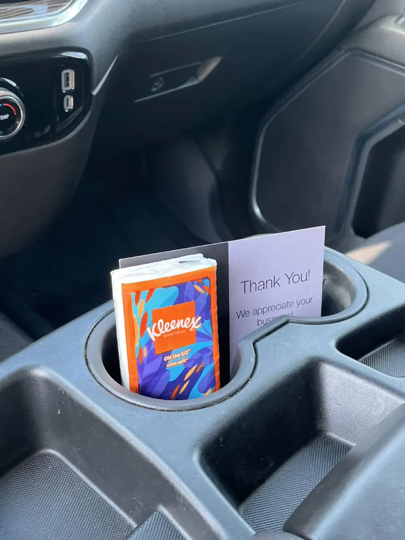 A&N thank-you card and tissue pack left in a clean cupholder